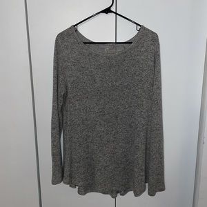 Long sleeved light grey blouse.